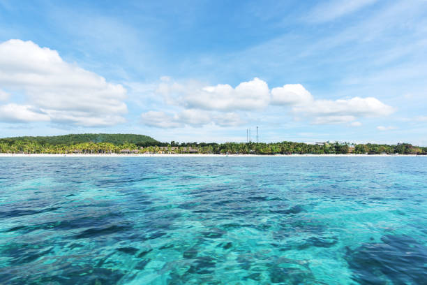istock Tropical Paradise Island And Blue Sky Landscape 1127299041