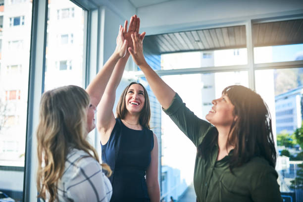 istock High five to achieving all our business goals 1127300064