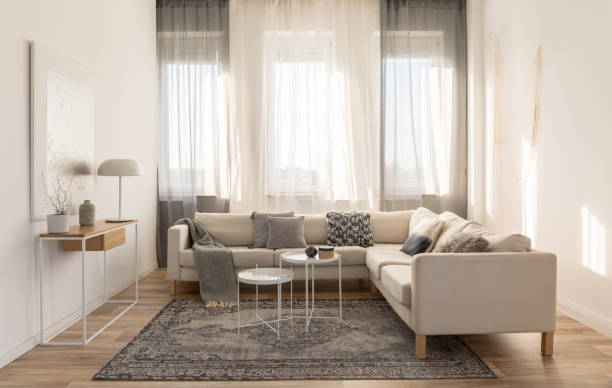 istock Beige grey and white living room interior design with corner sofa and two coffee tables 1127300770