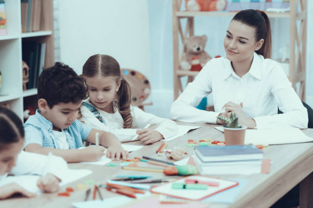 istock Kids in Kindergarten learn to draw with pencils 1127301040