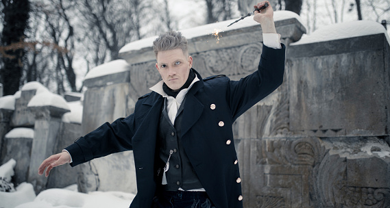 Somebody Using Magic Young Man In Image Of Black Magician Makes A Spell Using Magic Wand ...