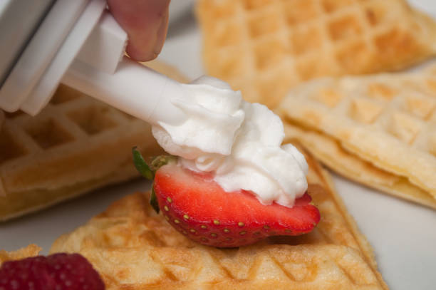 istock strawberry with chantilly cream on waffle in shaped heart in a white plate 1127301309