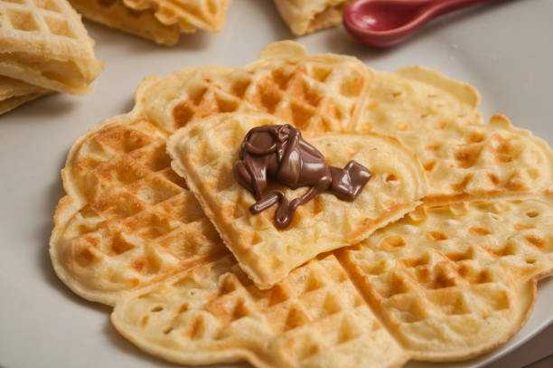 istock waffle in shaped heart with chocolate in a white plate 1127301347