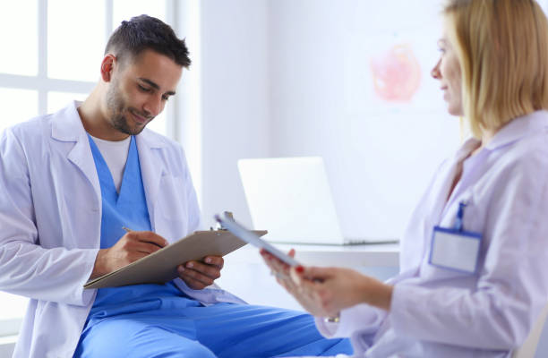 istock Young and confident doctors portrait standing in medical office 1127301436