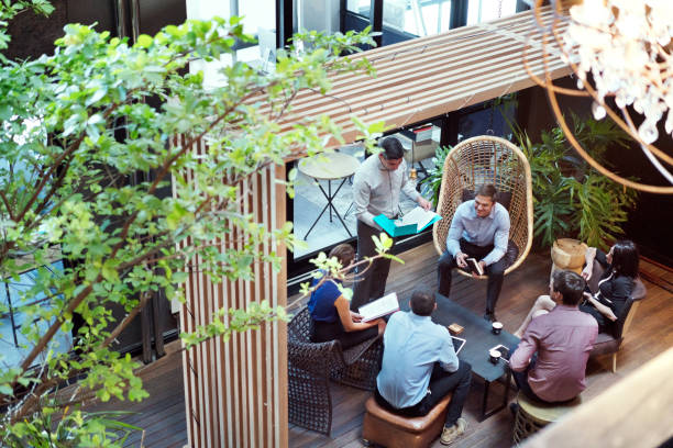 istock Business colleagues discussing at office lobby 1127301624
