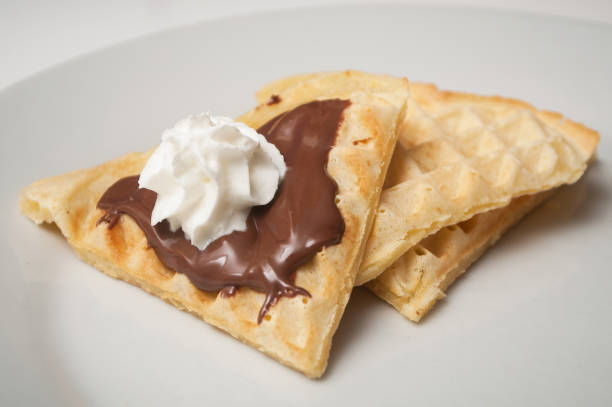istock waffle in shaped heart with chocolate and chantilly cream in a white plate 1127301754