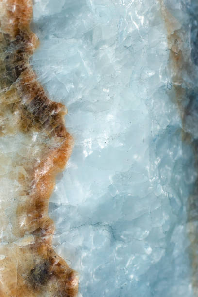 istock Vertical lightened slices of blue marble quartz ice background. Cold calm colors icy background ideal for your design 1127303009