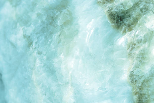 istock Horizontal lightened slices of blue marble quartz ice background. Cold calm colors icy background ideal for your design 1127303110