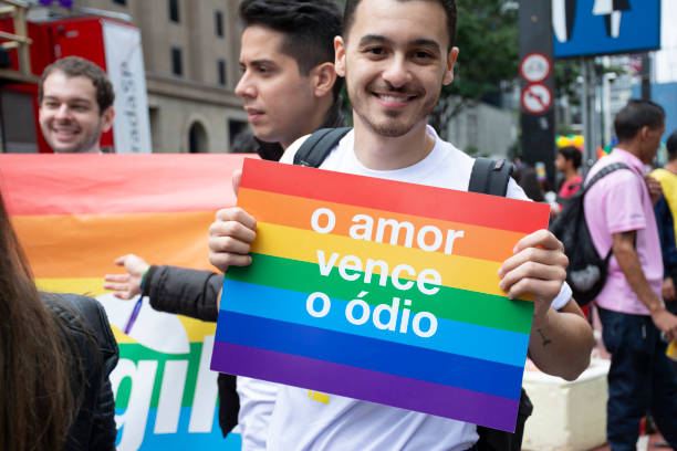 Gay Pride Parade 2018 - Sao Paulo Sao Paulo, Brazil - June 03: People attend the Gay Pride Parade on June 3, 2018 in Sao Paulo, Brazil. 
People gathered in Sao Paulo for the 22nd annual Gay Pride parade, which is considered one of the biggest ones in the world. At the parade, the participants demonstrated for the rights of homosexuals. gender fluid photos stock pictures, royalty-free photos & images