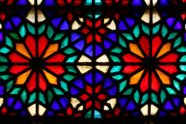 istock Beautiful colorful stained glass window patterns in Yazd, Iran 1127304305