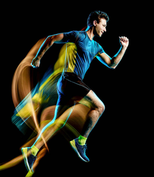 istock runner running jogger jogging man isolated light painting black background 1127304434