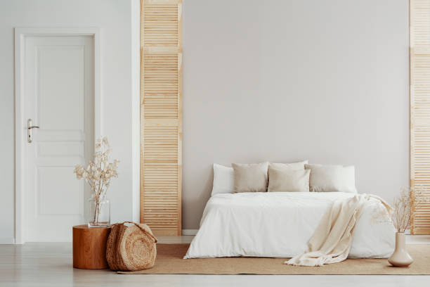 istock Beige and white bedroom in natural, rustic style 1127305108