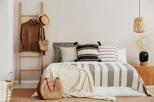 istock Monochromatic bedroom with wooden accents 1127305109