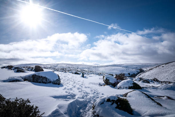 Midday Sun and snow across the Moor Looking back toward Dartmoor from just outside Mortenhampstead, Dartmoor, Devon. February 3rd, 2019 dartmoor photos stock pictures, royalty-free photos & images