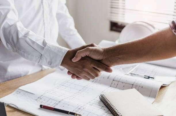 istock construction worker team hands shaking after consultation meeting to greeting start up plan new project contract in office center at construction site, teamwork, partnership and contractor concept 1127307438