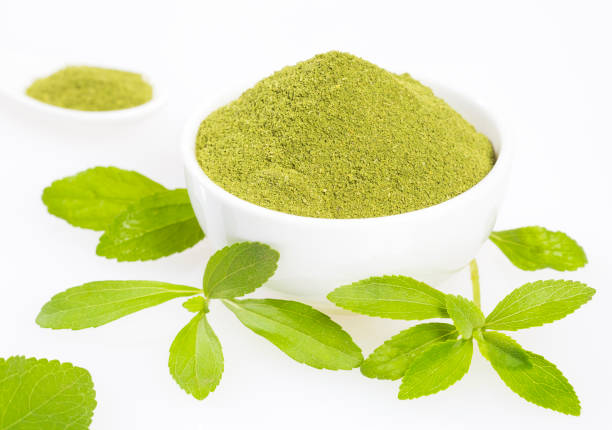 istock Fresh green Stevia herb and extract powder - Stevia rebaudiana. white background 1127309202