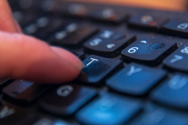 istock Pressing T letter on keyboard dis focusing everything 1127309214