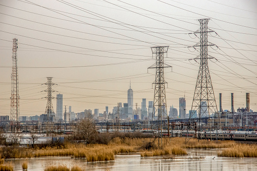 New York City skyline and power towers on a wintry day, seen from the Amtrak Northeast Regional train.