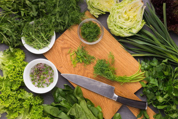 istock Cooking fresh detox salad on kitchen table 1127309538