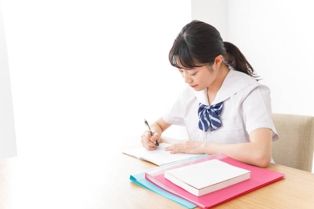 istock Pretty smiling teenager studying 1127311199