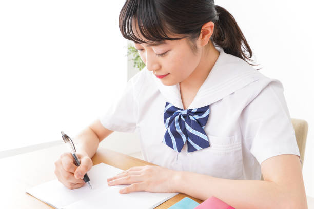 istock Pretty smiling teenager studying 1127311209