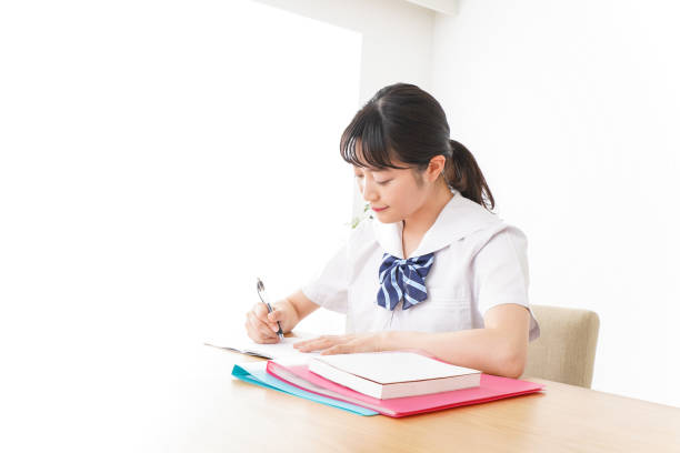 istock Pretty smiling teenager studying 1127311226