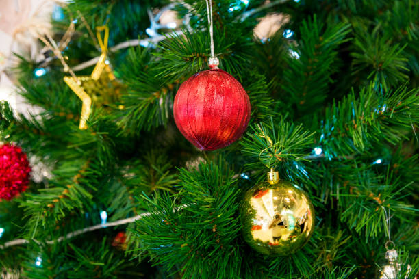 istock Red and Golden Christmas Balls on Branches 1127311546