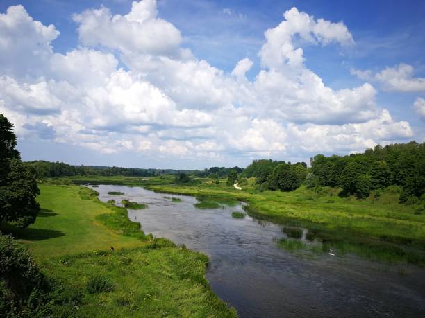 istock River Venta flowing in the green valley 1127312882
