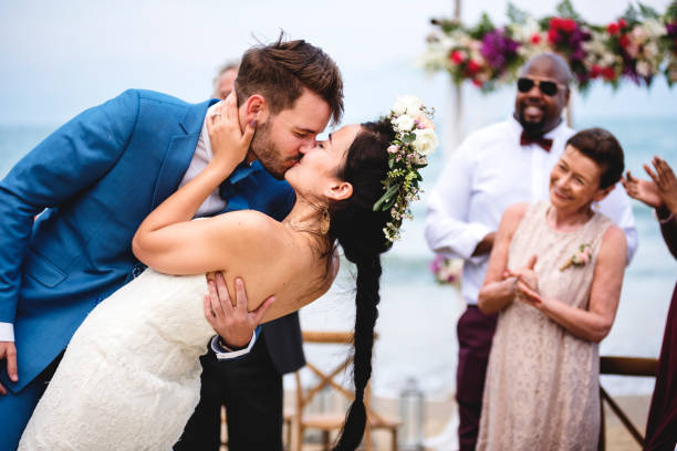 istock Cheerful newlyweds at beach wedding ceremnoy 1127314907