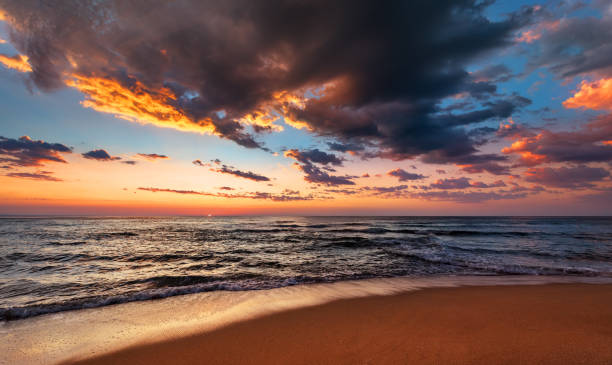 istock Sunset seascape with dramatic sky and colorful clouds. 1127316176