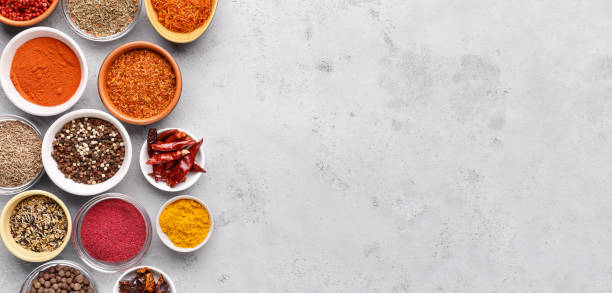 istock Spices and condiments in bowls on grey background 1127316658