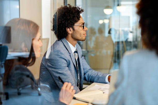 istock Business colleagues seen through glass at office 1127316892