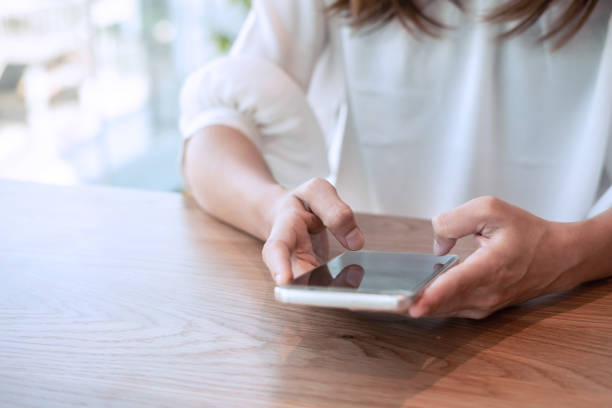 istock Young woman surfing internet on her smartphone 1127317877