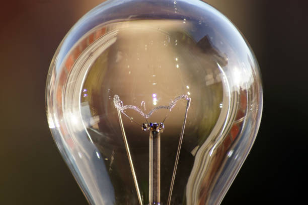 istock Close-up of a light bulb green current 1127318032