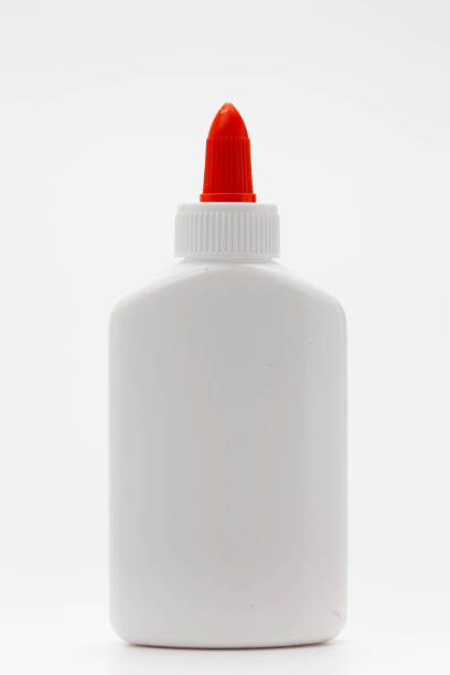 istock Glue Leak from White Glue Bottle with Spreader Cap on white 1127320393