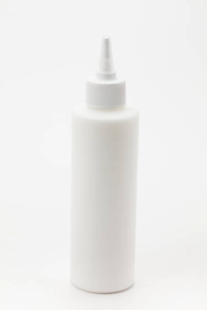 istock Glue Leak from White Glue Bottle with Spreader Cap on white 1127320413