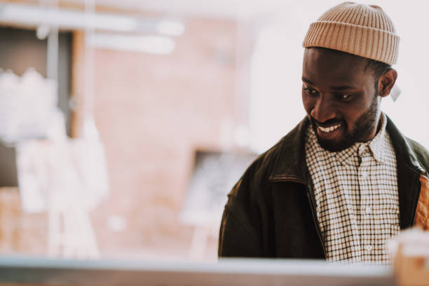 Positive young man turning his head and smiling