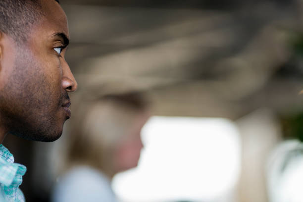 istock Thoughtful businessman looking away at office 1127322019