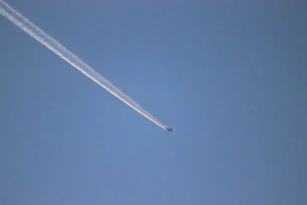 Aircraft with contrails in the direction of the southeast