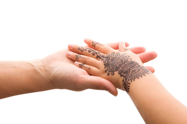 istock Child hand with henna holding mother's hand. 1127323246