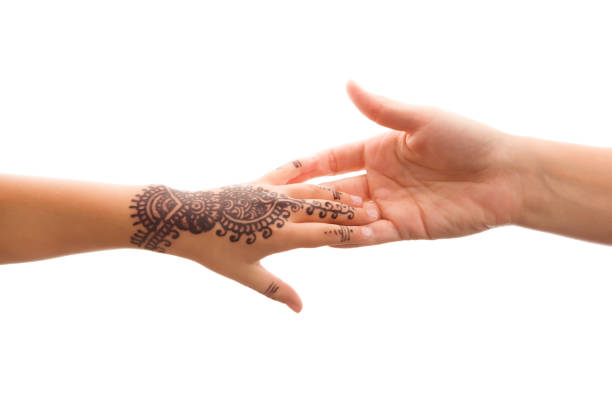 istock Child hand with henna holding mother's hand. 1127323247