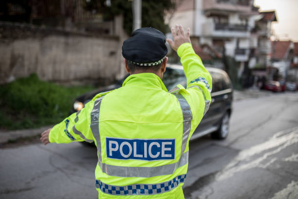 istock Traffic police office showing a car to stop 1127324441