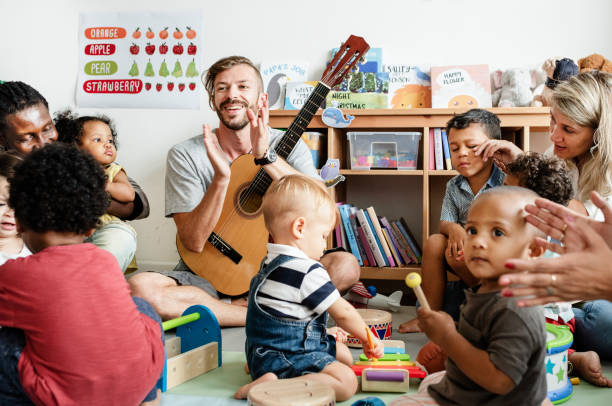 istock Nursery children playing with musical instruments in the classroom 1127326292