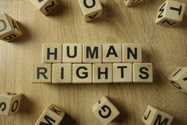 human rights text from wooden blocks - war criminal imagens e fotografias de stock