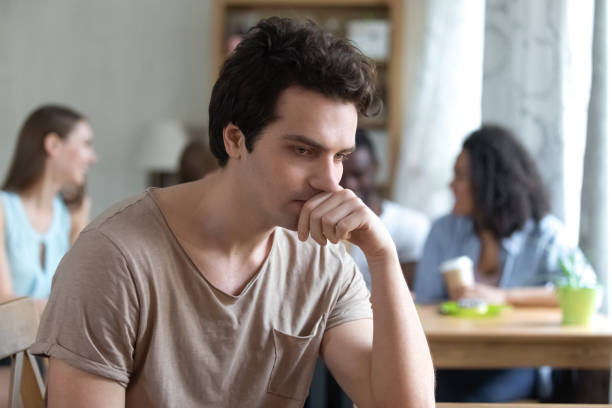 istock Upset thoughtful man sitting alone, low self-esteem, have no friends 1127327163
