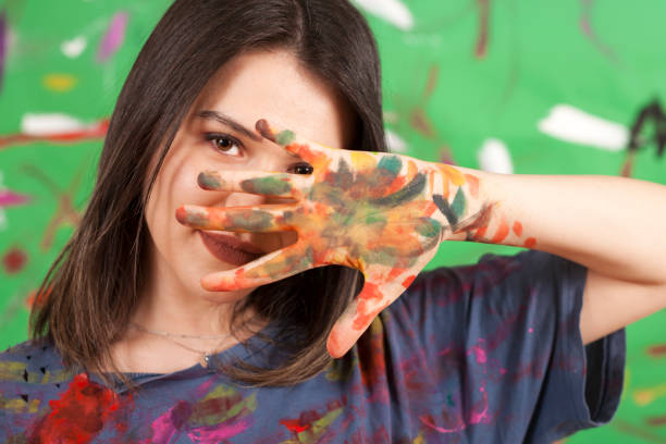 istock beautiful artist woman painter 1127329424