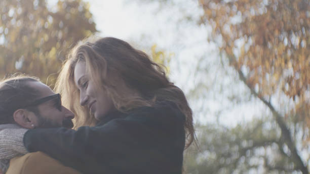 istock Loving couple cuddling on autumn day in forest 1127330368