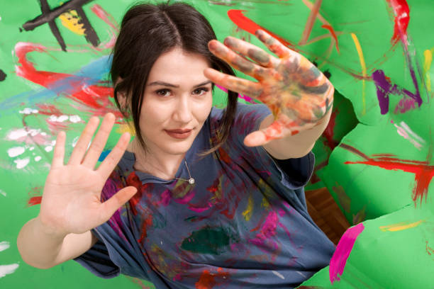 istock beautiful artist woman painter 1127330373