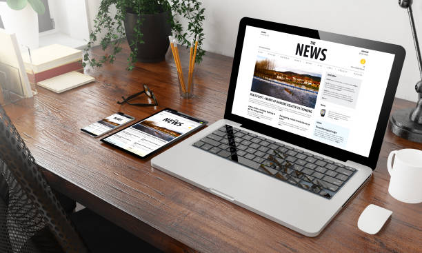 istock devices news on wooden desktop 1127330514