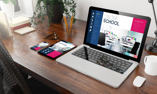 istock devices online school on wooden desktop 1127330519